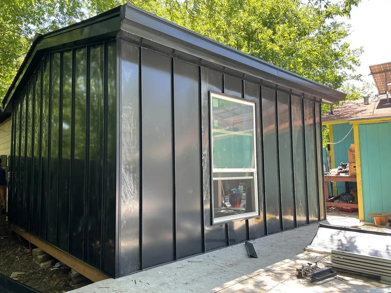 Black standing seam metal wall panels for Roof Inspection in North Miami