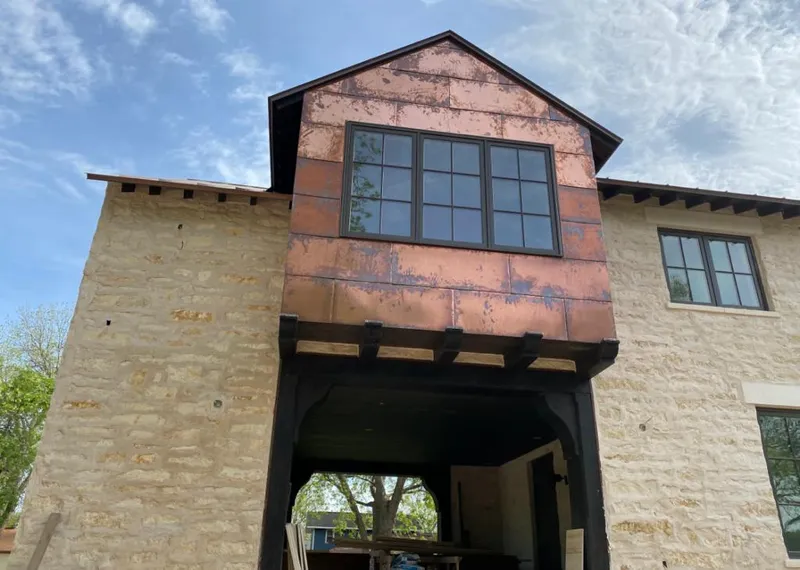 Copper metal panel facade on a stone building for Skylight Installation in North Miami