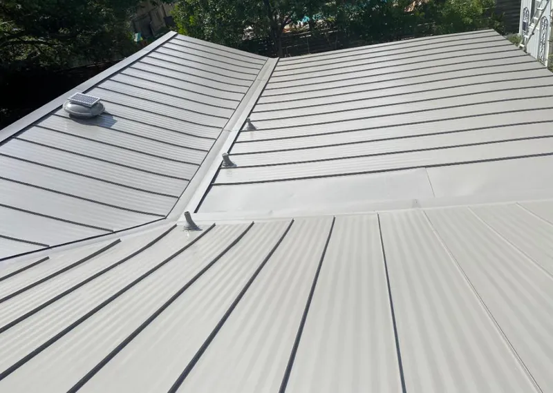 Solar attic fan installed on a metal roof for Roof Ventilation in North Miami
